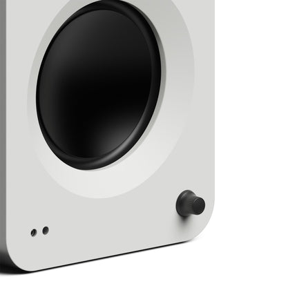 Kanto Audio REN powered speakers in white, volume knob and woofer detail