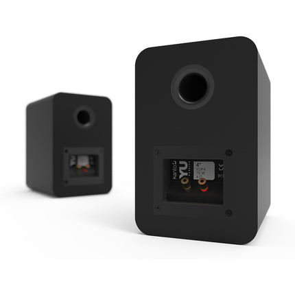 Back of the black Kanto Audio YUP4 pair: binding posts and bass reflex port